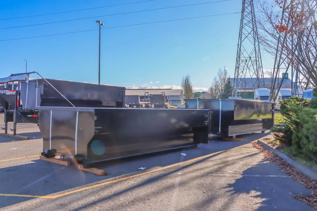 Roll-off dumpster ready for waste disposal at job site for 12 Yard Dumpster Rental in Rendon
